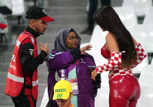 Croatia fan and model Ivana Knoll (right) speaks with security in the stands ahead of the FIFA World Cup Quarter-Final match at the Education City Stadium in Al Rayyan, Qatar. Picture date: Friday December 9, 2022